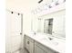 Bathroom with double sink vanity and neutral decor at 760 Annabell Ridge Rd, Minneola, FL 34715
