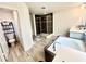Modern bathroom showcasing a soaking tub and shower with elegant fixtures at 760 Annabell Ridge Rd, Minneola, FL 34715