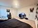 Bright bedroom features a gaming setup and neutral decor at 760 Annabell Ridge Rd, Minneola, FL 34715