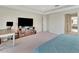 Serene primary bedroom suite featuring a TV, desk, and plush carpeting at 760 Annabell Ridge Rd, Minneola, FL 34715