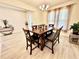 Inviting dining room featuring a wood table set next to a window with sheer curtains at 760 Annabell Ridge Rd, Minneola, FL 34715