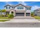 Charming two-story home with stone accents and three-car garage at 760 Annabell Ridge Rd, Minneola, FL 34715