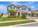Charming two-story home with stone accents, lush landscaping and two-car garage at 760 Annabell Ridge Rd, Minneola, FL 34715