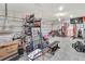 Two car garage with lots of space for parking and exercise equipment at 760 Annabell Ridge Rd, Minneola, FL 34715