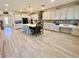 Bright kitchen features an oversized island with seating, modern appliances, and stunning backsplash at 760 Annabell Ridge Rd, Minneola, FL 34715