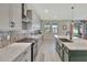 Well-appointed kitchen featuring a gas range, white countertops, tiled backsplash, and modern cabinetry at 760 Annabell Ridge Rd, Minneola, FL 34715