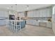 Expansive kitchen with bright cabinets, a large center island with seating, and stainless steel appliances at 760 Annabell Ridge Rd, Minneola, FL 34715