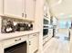 Beautiful kitchen showcasing stainless steel appliances, ample counter space, and stylish cabinets with bronze hardware at 760 Annabell Ridge Rd, Minneola, FL 34715