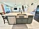 Large kitchen island with bar seating and stainless steel farmhouse style sink at 760 Annabell Ridge Rd, Minneola, FL 34715