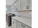 Well-equipped laundry room with modern washer, dryer, sink, and ample counter and cabinet space at 760 Annabell Ridge Rd, Minneola, FL 34715