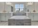 Main bathroom with soaking tub, dual vanities, and a window at 760 Annabell Ridge Rd, Minneola, FL 34715