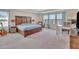 Spacious main bedroom with a large bed, carpeted floor, and natural light from the windows at 760 Annabell Ridge Rd, Minneola, FL 34715