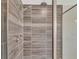 Custom shower with dual shower heads and sleek gray tile at 760 Annabell Ridge Rd, Minneola, FL 34715