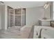 The luxurious shower and tub are tiled with grey tile at 760 Annabell Ridge Rd, Minneola, FL 34715