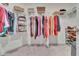 Organized walk-in closet with metal shelving for folded clothes, shoes, and hanging apparel at 760 Annabell Ridge Rd, Minneola, FL 34715
