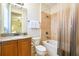 Bright bathroom with granite countertops and a shower and tub combination at 7824 Loxahatchee Ct, Reunion, FL 34747