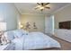 Charming bedroom with whimsical cartoon decor, bright lighting, and comfortable furnishings at 7824 Loxahatchee Ct, Reunion, FL 34747