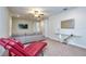 Bonus room with comfortable seating, large television, contemporary decor, and neutral carpeting at 7824 Loxahatchee Ct, Reunion, FL 34747