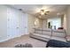 This bonus room boasts plush seating, neutral carpeting, and two closet areas for storage at 7824 Loxahatchee Ct, Reunion, FL 34747