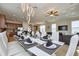 Open concept dining area adjoining a modern kitchen and comfortable living space, great for gatherings at 7824 Loxahatchee Ct, Reunion, FL 34747