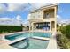 Stunning two-story home with a pool, patio, and lush landscaping at 7824 Loxahatchee Ct, Reunion, FL 34747