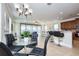Open floor plan showcasing the living and dining area with stylish furnishings and natural light at 7824 Loxahatchee Ct, Reunion, FL 34747
