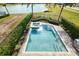 Inviting backyard pool and spa with a view of the lake, perfect for relaxing and entertaining at 7824 Loxahatchee Ct, Reunion, FL 34747