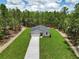 Aerial view of the property showcasing its well-manicured lawn at 8459 Sw 138Th Ter, Dunnellon, FL 34432