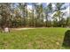 Expansive backyard featuring a lush lawn at 8459 Sw 138Th Ter, Dunnellon, FL 34432