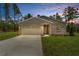 Charming single-story home featuring a two-car garage, neutral paint scheme, and well-manicured lawn at 8459 Sw 138Th Ter, Dunnellon, FL 34432