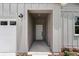 Inviting entryway featuring a neutral color scheme and modern light fixtures at 8459 Sw 138Th Ter, Dunnellon, FL 34432