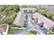 Aerial view of condo buildings with parking lots and surrounding landscape at 8830 Coral Palms Ct # A, Kissimmee, FL 34747