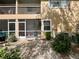 Back of property featuring screened patio at 8830 Coral Palms Ct # A, Kissimmee, FL 34747