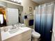 Bright bathroom featuring modern vanity, framed mirror, and shower-tub combo at 8830 Coral Palms Ct # A, Kissimmee, FL 34747