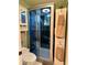 Modern bathroom with a sleek glass enclosed shower and updated fixtures at 8830 Coral Palms Ct # A, Kissimmee, FL 34747