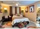 Cozy bedroom with natural light, carpeted flooring, and stylish wall decor at 8830 Coral Palms Ct # A, Kissimmee, FL 34747