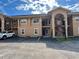 Well-maintained condo building with private parking and easy access to units via outdoor staircases at 8830 Coral Palms Ct # A, Kissimmee, FL 34747
