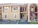 Exterior shot of a two-story condo building with parking in front at 8830 Coral Palms Ct # A, Kissimmee, FL 34747