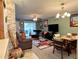 Inviting living room featuring neutral paint, ceiling fan, and dining area at 8830 Coral Palms Ct # A, Kissimmee, FL 34747