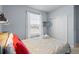 Cozy bedroom featuring a comfortable bed, closet, and a mounted television at 926 Paradise Dr, Davenport, FL 33897