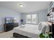 Relaxing bedroom showcasing a king bed, ceiling fan, and mounted TV at 926 Paradise Dr, Davenport, FL 33897