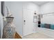 Inviting entryway featuring a coat rack bench, decorative vase, and neutral color palette at 926 Paradise Dr, Davenport, FL 33897