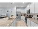 Bright kitchen featuring granite countertops, stainless steel appliances, and ample cabinet space at 926 Paradise Dr, Davenport, FL 33897