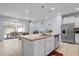 Open-concept kitchen with granite countertops, stainless steel appliances, and a view to living spaces at 926 Paradise Dr, Davenport, FL 33897