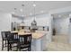 Spacious kitchen with granite island, stainless steel appliances, and modern lighting fixtures at 926 Paradise Dr, Davenport, FL 33897