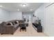 Spacious living room with comfortable sectional sofa and entertainment center with television at 926 Paradise Dr, Davenport, FL 33897