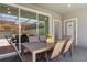 Outdoor patio with dining table and seating, perfect for alfresco dining and entertainment at 926 Paradise Dr, Davenport, FL 33897