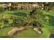 Aerial view of a golf course community, showcasing the lush green landscape and beautiful architecture at 9346 San Jose Blvd, Howey In The Hills, FL 34737