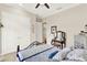 Charming bedroom with a double bed, ceiling fan, vanity area, and a double door closet at 9346 San Jose Blvd, Howey In The Hills, FL 34737