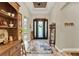 Elegant entryway with a decorative front door, stylish rug, and tasteful decor at 9346 San Jose Blvd, Howey In The Hills, FL 34737